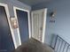 Unit 203 entryway with a modern security door, blue trim and a charming vintage-style lantern at 5320 Portavilla Ct # 203, Las Vegas, NV 89122