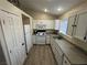 Bright kitchen featuring white cabinetry, modern appliances, and durable countertops at 5320 Portavilla Ct # 203, Las Vegas, NV 89122