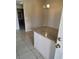 Open-concept dining area with granite-topped bar, and tile flooring at 5750 E Hacienda Ave # 117, Las Vegas, NV 89122