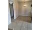 Spacious dining area featuring tile flooring, neutral walls, and modern lighting fixture at 5750 E Hacienda Ave # 117, Las Vegas, NV 89122