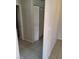 Hallway featuring tile flooring with white bi-fold closet doors at 5750 E Hacienda Ave # 117, Las Vegas, NV 89122