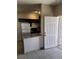 Interior shot showcasing the kitchen featuring dark cabinets and granite countertops at 5750 E Hacienda Ave # 117, Las Vegas, NV 89122