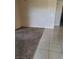 A living room featuring carpet and tiled flooring at 5750 E Hacienda Ave # 117, Las Vegas, NV 89122