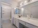 Bright bathroom features a large vanity, dual mirrors, and a shower/tub combo at 5841 Medallion Dr # 202, Las Vegas, NV 89122