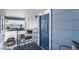 An apartment front door with a small patio, featuring gray outdoor furniture at 5841 Medallion Dr # 202, Las Vegas, NV 89122