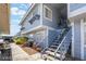 Exterior view of a multi-story home featuring stairs, windows, and a light blue exterior at 5841 Medallion Dr # 202, Las Vegas, NV 89122
