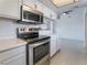 Modern kitchen with stainless steel appliances, white cabinets and plenty of counter space at 5841 Medallion Dr # 202, Las Vegas, NV 89122