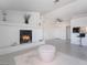 Spacious living area features a modern fireplace, bar seating, and contemporary design at 5841 Medallion Dr # 202, Las Vegas, NV 89122
