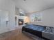 Comfortable main bedroom with fireplace and TV features natural light and adjacent workspace at 5841 Medallion Dr # 202, Las Vegas, NV 89122