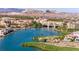 Breathtaking aerial view of a lakeside community with stunning architecture and scenic mountain backdrop at 59 Reflection Bay Dr, Henderson, NV 89011