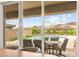 Inviting covered patio with views of the sparkling pool and desert landscape at 59 Reflection Bay Dr, Henderson, NV 89011