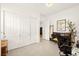 Bright bedroom featuring a closet with sliding doors and a black accent chair at 59 Reflection Bay Dr, Henderson, NV 89011