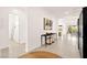 Bright hallway with tile flooring, modern decor, and open view to the backyard at 59 Reflection Bay Dr, Henderson, NV 89011