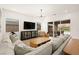 Bright living room with a modern chandelier and access to the outdoor pool area at 59 Reflection Bay Dr, Henderson, NV 89011