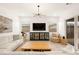 Well-lit living room with stylish decor, comfortable seating, and access to the patio at 59 Reflection Bay Dr, Henderson, NV 89011