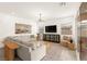 Inviting living room with a comfortable sectional sofa and elegant decor at 59 Reflection Bay Dr, Henderson, NV 89011