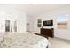 Spacious bedroom featuring neutral paint and a mounted TV for relaxing evenings at 59 Reflection Bay Dr, Henderson, NV 89011