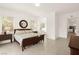 Inviting bedroom featuring a comfortable bed, ample natural light, and neutral paint at 59 Reflection Bay Dr, Henderson, NV 89011