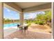 Covered patio overlooking the pool, lake, and desert landscape at 59 Reflection Bay Dr, Henderson, NV 89011
