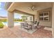 Inviting covered patio with plush seating and mountain views at 59 Reflection Bay Dr, Henderson, NV 89011