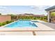 Sparkling pool with mountain views and desert landscaping, perfect for outdoor enjoyment at 59 Reflection Bay Dr, Henderson, NV 89011