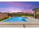 Inviting pool with mountain views and landscaped surroundings for relaxing outdoor living at 59 Reflection Bay Dr, Henderson, NV 89011