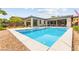 Backyard view of the gorgeous pool and landscaping of this lovely home at 59 Reflection Bay Dr, Henderson, NV 89011