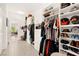 Spacious walk-in closet with organized shelving, clothing racks, and ample storage space for shoes and accessories at 59 Reflection Bay Dr, Henderson, NV 89011