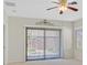 Bedroom featuring neutral walls, carpeting, and a sliding glass door at 6064 Isola Peak Ave, Las Vegas, NV 89122