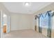 Bedroom featuring neutral walls, carpeting, and an ensuite bathroom at 6064 Isola Peak Ave, Las Vegas, NV 89122