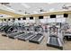 Fitness center with treadmills, elliptical machines, and mounted TVs for entertainment during workouts at 6064 Isola Peak Ave, Las Vegas, NV 89122