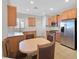 Kitchen features stainless steel appliances, tile flooring, and wooden cabinets at 6064 Isola Peak Ave, Las Vegas, NV 89122
