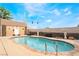 Inviting backyard pool featuring mature landscaping, an outdoor shed and mature plants at 6141 Babson Ave, Las Vegas, NV 89110