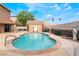 Beautiful backyard pool with desert landscaping and an outdoor shed at 6141 Babson Ave, Las Vegas, NV 89110