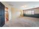 Bright bedroom with neutral carpet, large windows, and plenty of space for furniture at 6141 Babson Ave, Las Vegas, NV 89110