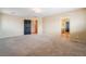 Spacious bedroom with neutral carpet and access to the en-suite bathroom at 6141 Babson Ave, Las Vegas, NV 89110