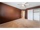 Bedroom with neutral carpet, a ceiling fan, and a closet providing ample storage space at 6141 Babson Ave, Las Vegas, NV 89110