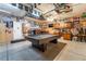Large garage is finished with pool table, cabinetry, sports memorabilia, and a rear entry door at 6141 Babson Ave, Las Vegas, NV 89110