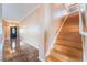 Hallway view featuring tile flooring, stairs, and a front door at 6141 Babson Ave, Las Vegas, NV 89110