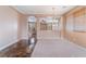 Open-concept living area with tile floors, neutral tones, and natural light at 6141 Babson Ave, Las Vegas, NV 89110