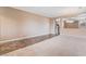 Neutral living room showcasing an open layout with tile and carpet flooring at 6141 Babson Ave, Las Vegas, NV 89110