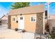 Charming shed with decorative vines, a welcoming door, and gravel landscaping at 6141 Babson Ave, Las Vegas, NV 89110