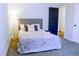 Cozy bedroom with carpet flooring and comfortable bed at 6198 Pinewood Ave, Las Vegas, NV 89103