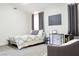 Bright bedroom with neutral colors, modern decor, and ample natural light at 6198 Pinewood Ave, Las Vegas, NV 89103