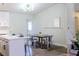Dining area with modern table and chairs, adjacent to kitchen at 6198 Pinewood Ave, Las Vegas, NV 89103
