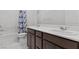 Bright bathroom with double vanity, modern fixtures, and a bathtub-shower combo at 6955 Elysian Valley Ave, Las Vegas, NV 89113