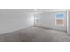 Bright bedroom with neutral walls, carpet and natural light from two windows at 6955 Elysian Valley Ave, Las Vegas, NV 89113