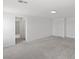 Upstairs bonus room featuring neutral walls and carpet, overhead lighting, and closet access at 6955 Elysian Valley Ave, Las Vegas, NV 89113