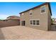Two story home with a large backyard and brick wall along the perimeter at 6955 Elysian Valley Ave, Las Vegas, NV 89113