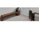 Neutral-colored carpeted room with a shuffleboard table and desk near window at 6955 Elysian Valley Ave, Las Vegas, NV 89113